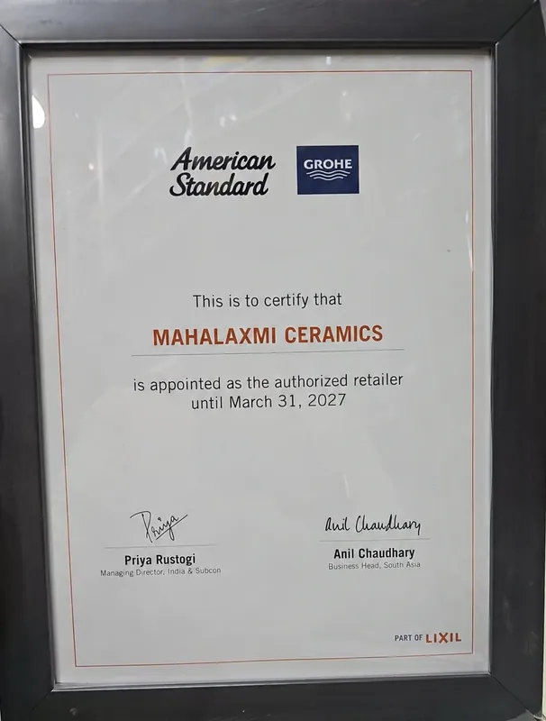 Framed LIXIL certificate appointing Mahalaxmi Ceramics as the authorised retailer for American Standard and GROHE, on display at Shop No 5
