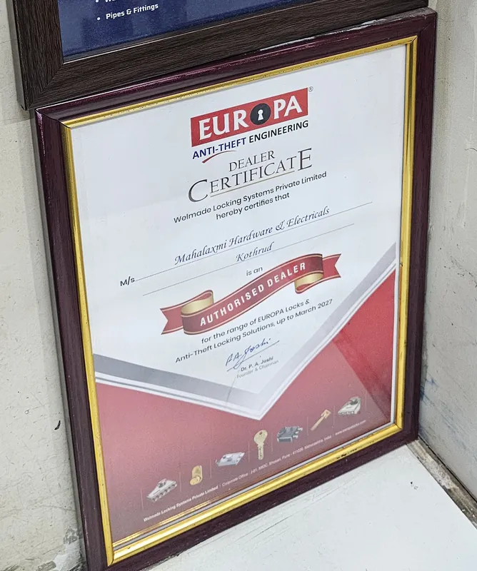 Framed Europa dealer certificate naming M/s Mahalaxmi Hardware and Electricals, Kothrud as an Authorised Dealer for Europa locks