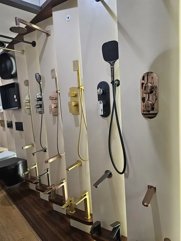 Close view of Jaquar hand showers, concealed diverters and spouts on display at Mahalaxmi Ceramics