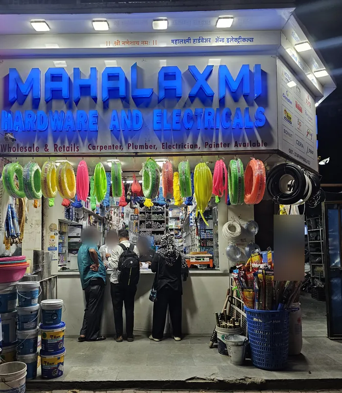 Mahalaxmi Hardware and Electricals shopfront on Paud Road, Kothrud, Pune, with customers at the counter